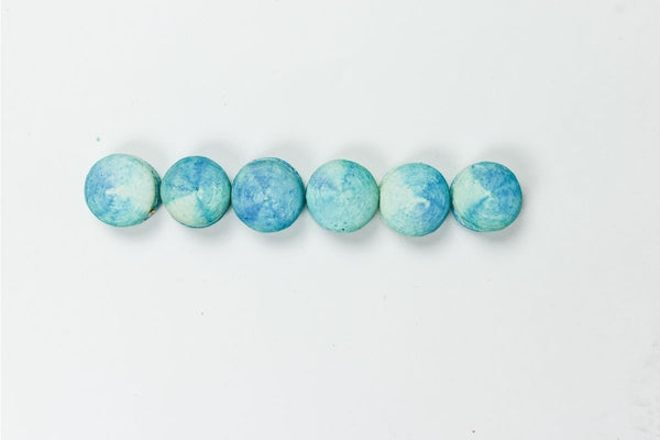 turquoise macaroons in a row